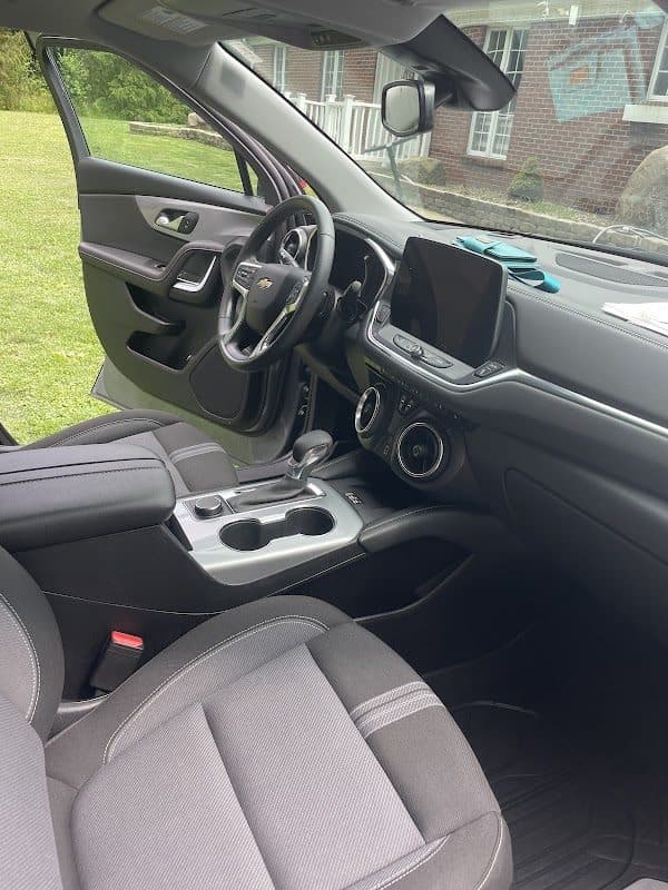 Clean Chevrolet Blazer interior showing the dash, console and front seats