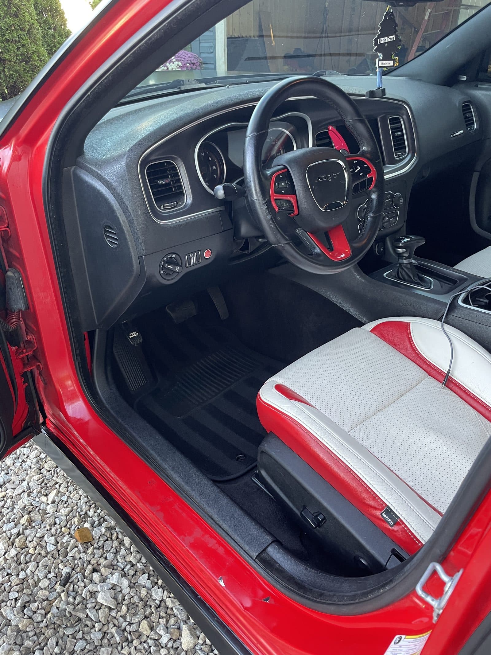 Red Dodge Charger dashboard and steering wheel after detailing